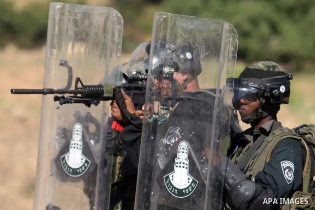 Israeli border police fires tear gas towards Palestinian protesters, during clashes on Nakba Day near Ofer prison, near Ramallah, the West Bank, 15 May 2012. Thousands marched in the West Bank and Gaza Strip, commemorati...