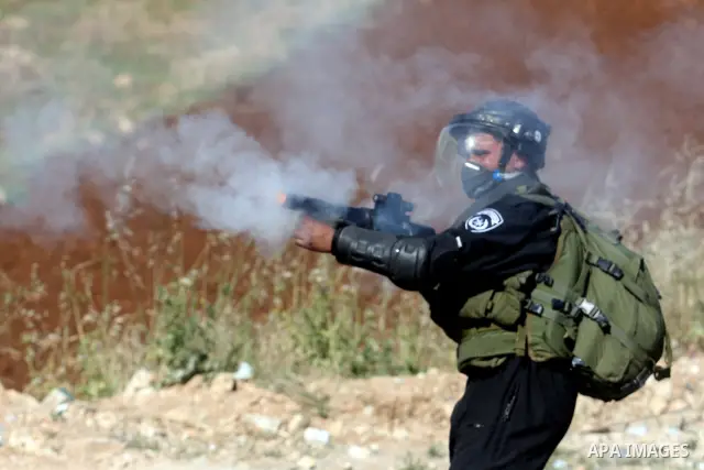 Israeli border police fires tear gas towards Palestinian protesters, during clashes on Nakba Day near Ofer prison, near Ramallah, the West Bank, 15 May 2012. Thousands marched in the West Bank and Gaza Strip, commemorati...