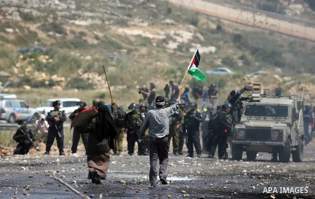 Israeli border police fires tear gas towards Palestinian protesters, during clashes on Nakba Day near Ofer prison, near Ramallah, the West Bank, 15 May 2012. Thousands marched in the West Bank and Gaza Strip, commemorati...