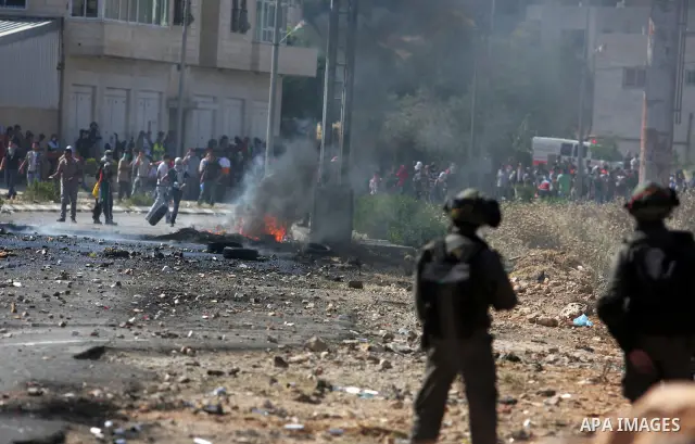 Israeli border police fires tear gas towards Palestinian protesters, during clashes on Nakba Day near Ofer prison, near Ramallah, the West Bank, 15 May 2012. Thousands marched in the West Bank and Gaza Strip, commemorati...
