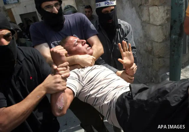 Israeli police officers detain a Palestinian after minor clashes between Palestinian stone-throwers and police in the East Jerusalem neighbourhood of Issawiya May 15, 2012. Israeli security forces were on high alert for...