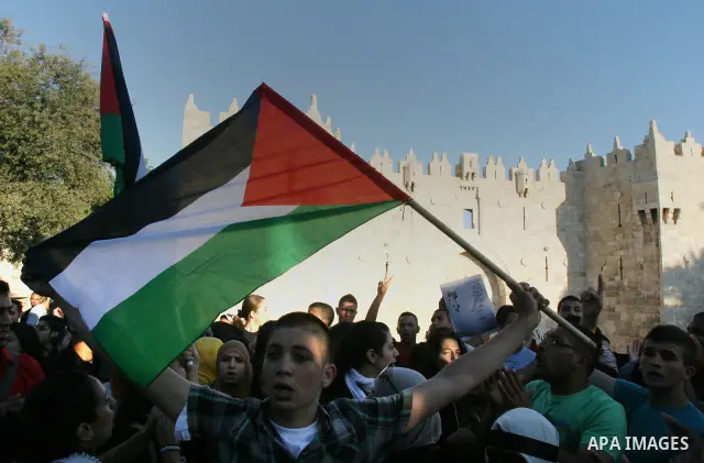 Palestinians protest outside Damascus gate in Jerusalem's Old City, during a 'Nakba Day' rally and march in East Jerusalem, 15 May 2012. Palestinians mark the Nakba, or the 'catastrophe', of israel's gaining statehood an...