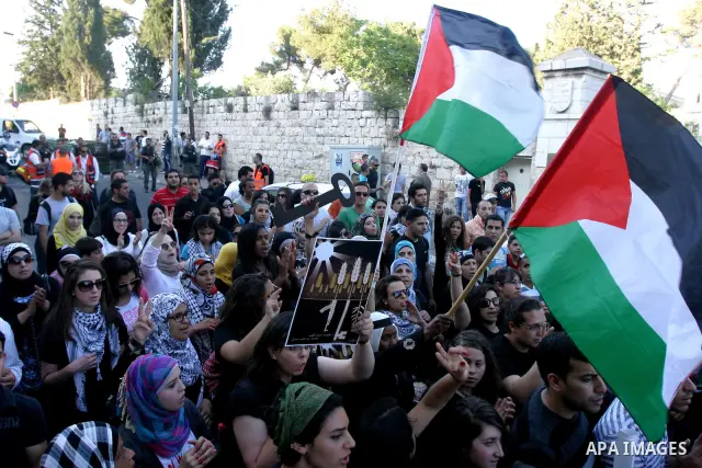 Palestinians protest outside Damascus gate in Jerusalem's Old City, during a 'Nakba Day' rally and march in East Jerusalem, 15 May 2012. Palestinians mark the Nakba, or the 'catastrophe', of israel's gaining statehood an...