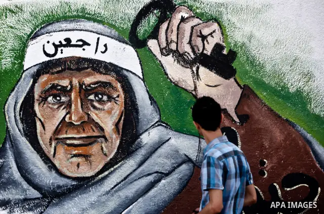 A Palestinian pasts newly painted mural on the 64th anniversary of "Nakba", Arabic for catastrophe, the term used to mark the events leading to Israel's founding in 1948, in Gaza City, Tuesday, May 15, 2012. Hundreds of...