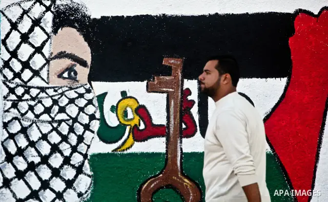 A Palestinian pasts newly painted mural on the 64th anniversary of "Nakba", Arabic for catastrophe, the term used to mark the events leading to Israel's founding in 1948, in Gaza City, Tuesday, May 15, 2012. Hundreds of...
