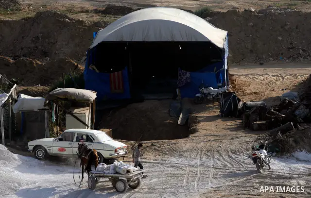 Palestinians transport goods by smuggling tunnels on the border between Egypt and Gaza in the southern Gaza Strip at the Rafah Refugee Camp on May 19, 2012. Living conditions in Gaza have deteriorated because of Israeli...