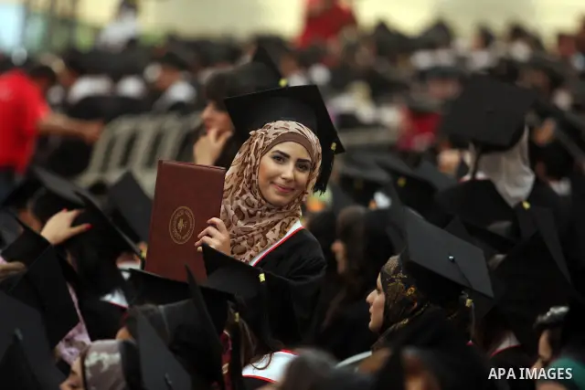 A Palestinian student looks over, during her graduation ceremony at the Birzeit University near the West Bank city of Ramallah. as some 3000 students received their degrees at the end of the academic year on May 19, 2012...