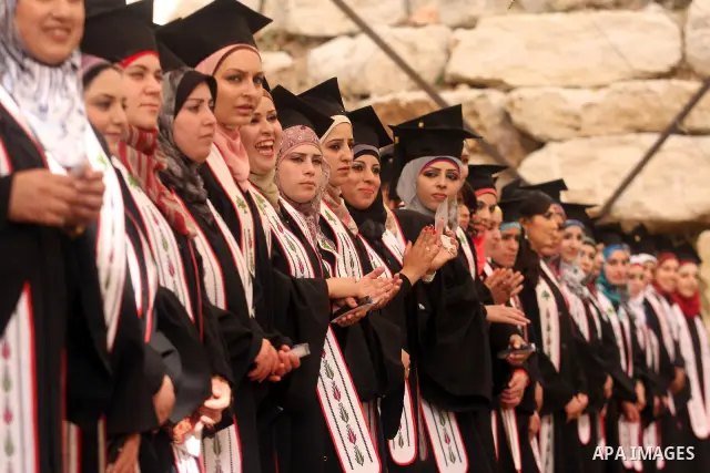 Palestinian students attend their graduation ceremony at the Birzeit University near the West Bank city of Ramallah. as some 3000 students received their degrees at the end of the academic year on May 19, 2012. Photo by...