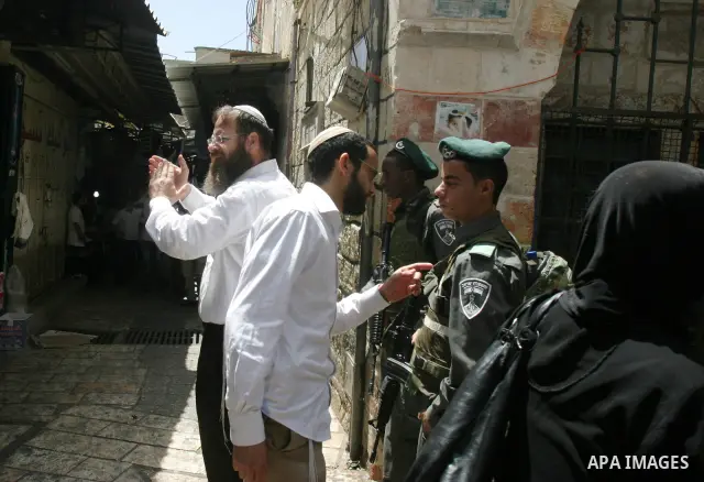 Israelis march and dance in the old city of Jerusalem on May 20, 2012 during Jerusalem Day celebrations marking the Jewish state's capture of the Arab eastern sector 45 years ago during the Six-Day War. Photo by Mahfouz...