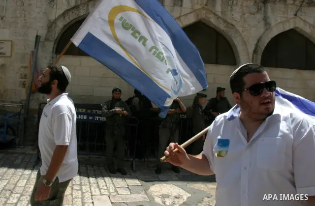 Israelis march and dance in the old city of Jerusalem on May 20, 2012 during Jerusalem Day celebrations marking the Jewish state's capture of the Arab eastern sector 45 years ago during the Six-Day War. Photo by Mahfouz...
