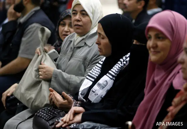 Palestinians receive the members of the convoy "Shad Al Rehal" from Global Coalition to support Jerusalem at the border between Egypt and Gaza in the southern Gaza Strip on May 20, 2012. the convoy have 68 solidarity of...