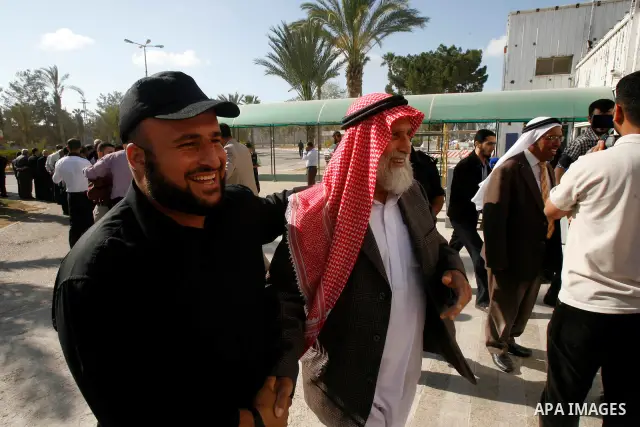 Palestinians receive the members of the convoy "Shad Al Rehal" from Global Coalition to support Jerusalem at the border between Egypt and Gaza in the southern Gaza Strip on May 20, 2012. the convoy have 68 solidarity of...