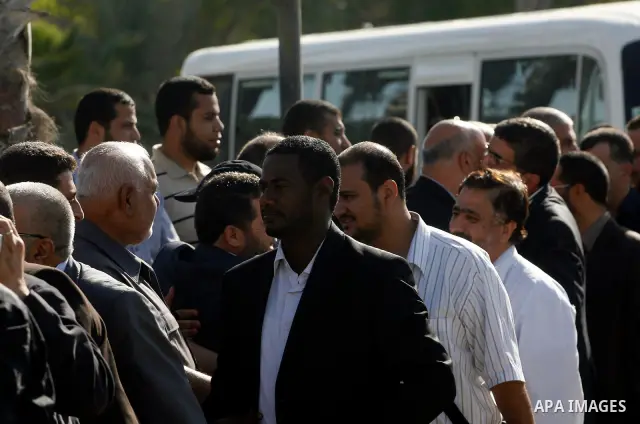 Palestinians receive the members of the convoy "Shad Al Rehal" from Global Coalition to support Jerusalem at the border between Egypt and Gaza in the southern Gaza Strip on May 20, 2012. the convoy have 68 solidarity of...