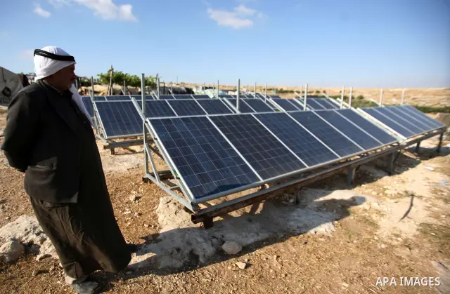 Palestinian Mohammed Nawaj'a inspects the project to generate alternative energy in his own land, near Jewish settlement of Susiya, in southern Hebron Khirbet Susiya, the West Bank on May 20, 2012. This projects was supp...