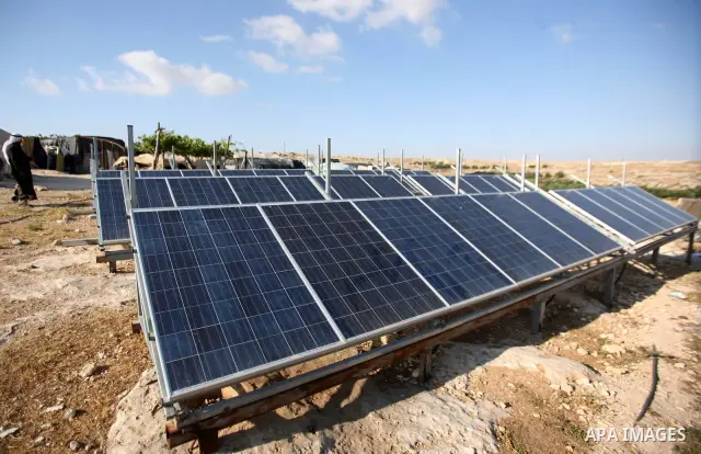 Palestinian Mohammed Nawaj'a inspects the project to generate alternative energy in his own land, near Jewish settlement of Susiya, in southern Hebron Khirbet Susiya, the West Bank on May 20, 2012. This projects was supp...