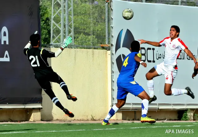 Tunisia and Sri Lanka footballers fight for possession during a football match. Tunisia and Sri Lanka footballers face-off during the Nakba Championship in the West Bank city of Nablus, on May 20, 2012. Nakba for the Pal...