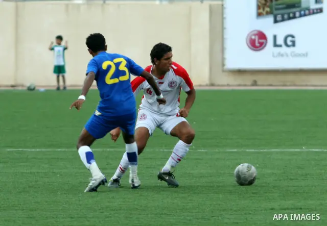Tunisia and Sri Lanka footballers fight for possession during a football match. Tunisia and Sri Lanka footballers face-off during the Nakba Championship in the West Bank city of Nablus, on May 20, 2012. Nakba for the Pal...