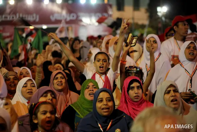 Supporters of the Muslim Brotherhood's presidential candidate Mohammed Mursi, unseen, hold a rally Cairo, Egypt, Sunday, May 20, 2012. Egypt's election commission is vowing that next week's presidential election will be...