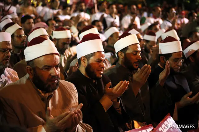 Supporters of the Muslim Brotherhood's presidential candidate Mohammed Mursi, unseen, hold a rally Cairo, Egypt, Sunday, May 20, 2012. Egypt's election commission is vowing that next week's presidential election will be...