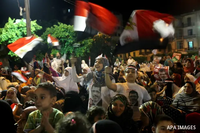 Supporters of the Muslim Brotherhood's presidential candidate Mohammed Mursi, unseen, hold a rally Cairo, Egypt, Sunday, May 20, 2012. Egypt's election commission is vowing that next week's presidential election will be...