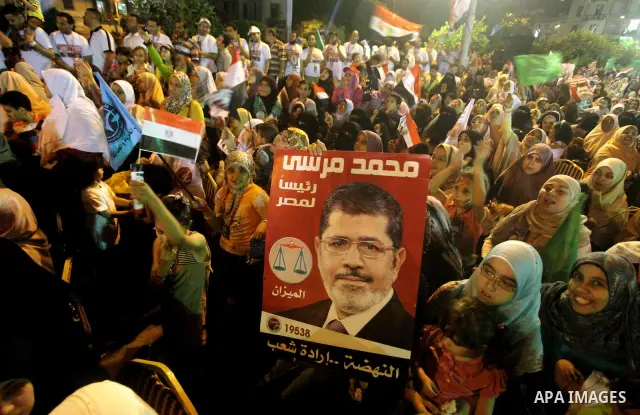 Supporters of the Muslim Brotherhood's presidential candidate Mohammed Mursi, unseen, hold a rally Cairo, Egypt, Sunday, May 20, 2012. Egypt's election commission is vowing that next week's presidential election will be...