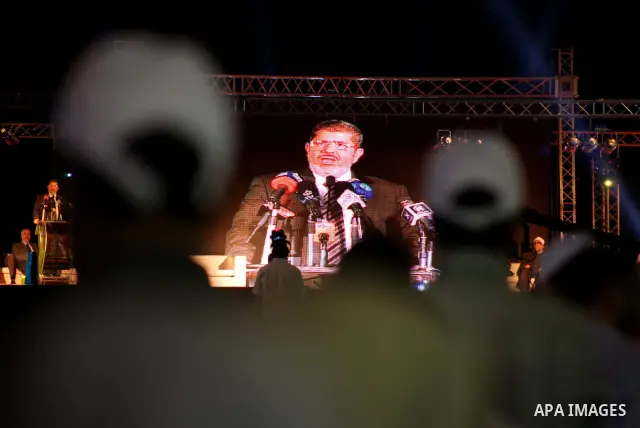 Mohamed Mursi, head of the Muslim Brotherhood's political party and the Brotherhood's presidential candidate, speaks during his last campaign rally in front of the Abdeen Palace Museum in Cairo May 20, 2012. Mursi has ca...