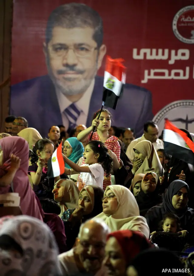 Supporters of the Muslim Brotherhood's presidential candidate Mohammed Mursi, unseen, hold a rally Cairo, Egypt, Sunday, May 20, 2012. Egypt's election commission is vowing that next week's presidential election will be...