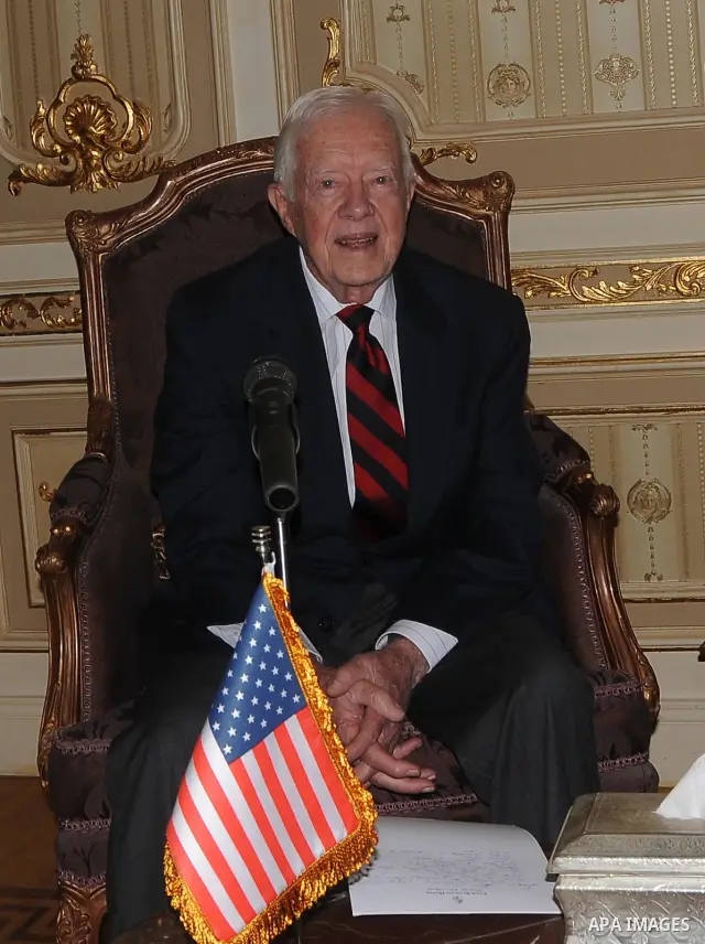 Former US president Jimmy Carter meets with Egyptian Parliament Speaker Saad al-Katatni in Cairo on May 21, 2012. Carter had arrived the previous day in Egypt with a delegation from his Carter Center to monitor Egypt's u...