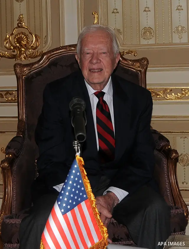 Former US president Jimmy Carter meets with Egyptian Parliament Speaker Saad al-Katatni in Cairo on May 21, 2012. Carter had arrived the previous day in Egypt with a delegation from his Carter Center to monitor Egypt's u...