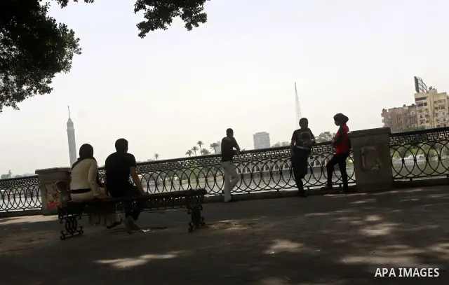Egyptians sit together in front of Nile river in Cairo May 22, 2012. Egypt holds its first truly competitive leadership election in its history from Wednesday to pick the man to replace Hosni Mubarak, ousted last year in...
