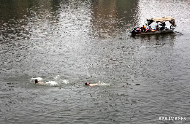 Egyptians enjoy swimming in the Nile River in Cairo, Egypt, May 22, 2012, one day before the country's landmark presidential elections. Photo by Ashraf Amra