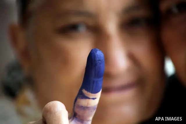 Egyptian woman shows her ink-marked finger after casting her ballot during the first round of Egypt's presidential elections, at a polling station in Cairo, Egypt, 23 May 2012. Egyptian voters, on 23 May, queued at polli...
