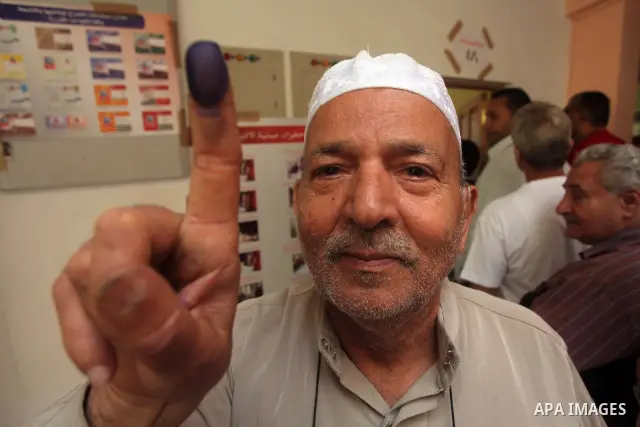 Egyptian man shows his ink-marked finger after casting his ballot during the first round of Egypt's presidential elections, at a polling station in Cairo, Egypt, 23 May 2012. Egyptian voters, on 23 May, queued at polling...