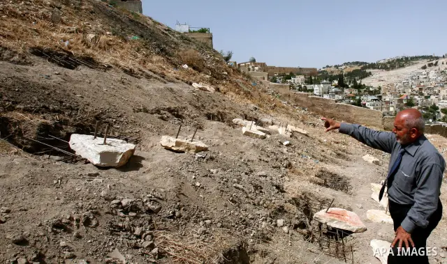 A Palestinian man walks on a land ready to be confiscated by israel authority as a cemetery for jewish in silwan Jerusalem's old city on May 23, 2012. Photo by Mahfouz Abu Turk