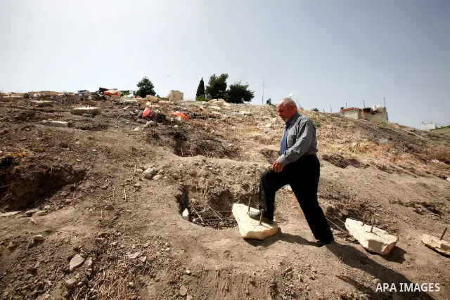 A Palestinian man walks on a land ready to be confiscated by israel authority as a cemetery for jewish in silwan Jerusalem's old city on May 23, 2012. Photo by Mahfouz Abu Turk