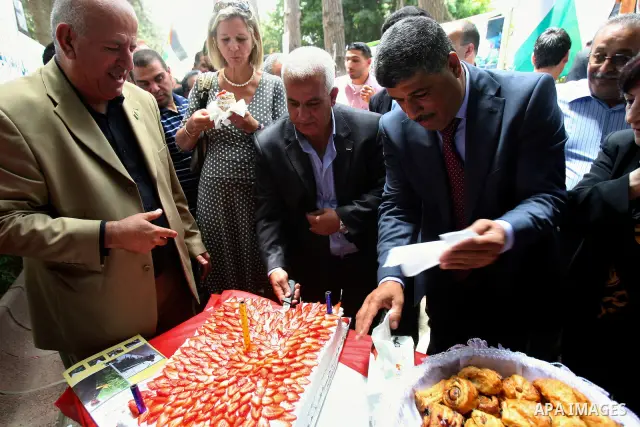 Palestinian Agriculture Minister with Representative of the Netherlands to the Palestinian National Authority, participate in the opening of Palestinian agricultural festival at strawberry and roses , in the West Bank ci...