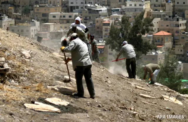 Workers build fake tombs at the alleged Jewish graves in a Palestinian area outside of Jerusalem in order to Judaize the area, in Valley Rababa, in Silwan Jerusalem's old city on May 24, 2012. Photo by Mahfouz Abu Turk