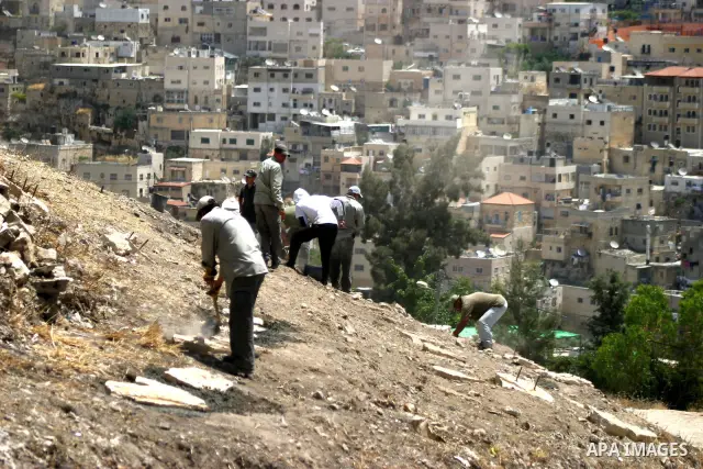 Workers build fake tombs at the alleged Jewish graves in a Palestinian area outside of Jerusalem in order to Judaize the area, in Valley Rababa, in Silwan Jerusalem's old city on May 24, 2012. Photo by Mahfouz Abu Turk