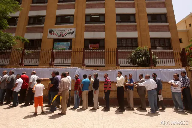 Egyptians wait to vote during second day of the first round of Egypt's presidential elections in Cairo, Egypt, 24 May 2012. Media reports quoting state-television and observers said that far less Egyptians turned out to...