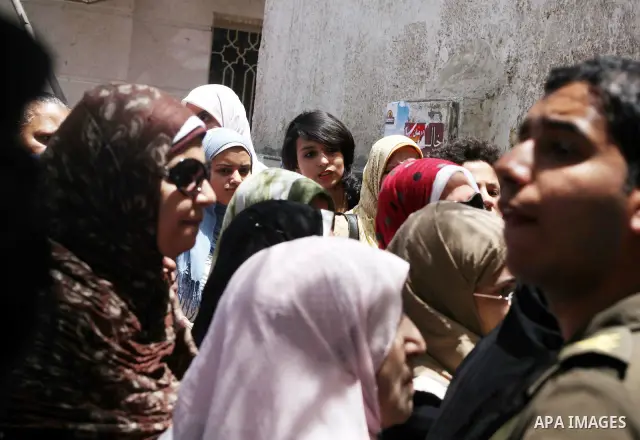 Egyptians wait to vote during second day of the first round of Egypt's presidential elections in Cairo, Egypt, 24 May 2012. Media reports quoting state-television and observers said that far less Egyptians turned out to...