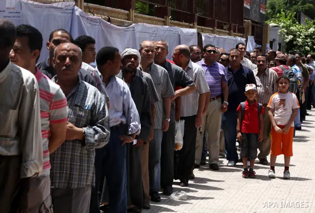 Egyptians wait to vote during second day of the first round of Egypt's presidential elections in Cairo, Egypt, 24 May 2012. Media reports quoting state-television and observers said that far less Egyptians turned out to...