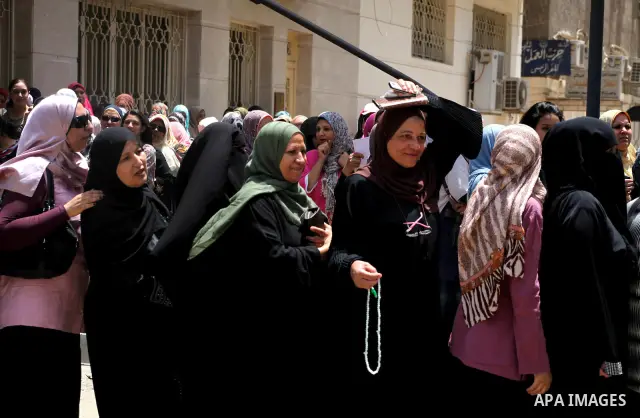 Egyptians wait to vote during second day of the first round of Egypt's presidential elections in Cairo, Egypt, 24 May 2012. Media reports quoting state-television and observers said that far less Egyptians turned out to...