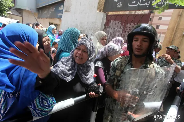 Egyptians wait to vote during second day of the first round of Egypt's presidential elections in Cairo, Egypt, 24 May 2012. Media reports quoting state-television and observers said that far less Egyptians turned out to...