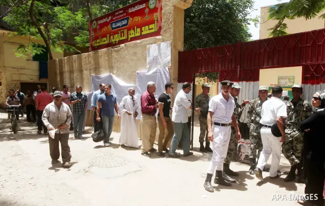 Egyptians wait to vote during second day of the first round of Egypt's presidential elections in Cairo, Egypt, 24 May 2012. Media reports quoting state-television and observers said that far less Egyptians turned out to...