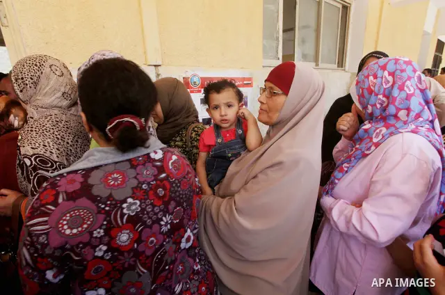 Egyptians wait to vote during second day of the first round of Egypt's presidential elections in Cairo, Egypt, 24 May 2012. Media reports quoting state-television and observers said that far less Egyptians turned out to...