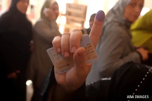 Egyptian woman shows her ink-marked finger after casting her ballot during the first round of Egypt's presidential elections, at a polling station in Cairo, Egypt, 24 May 2012. for the first Presidential election since t...