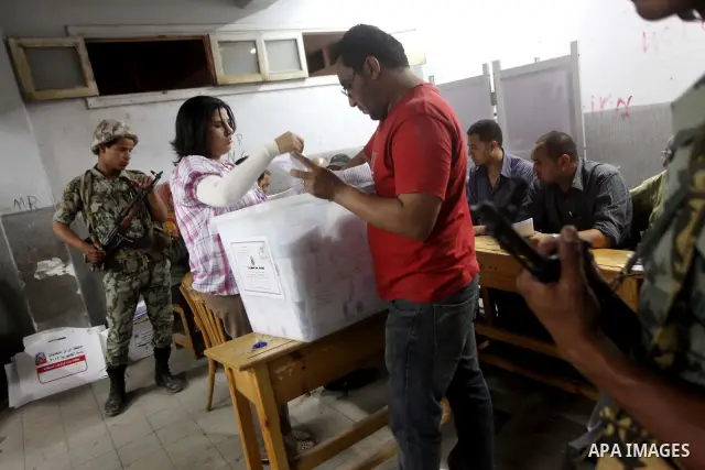 Egyptian election officials count ballots of the first round of Egypt's presidential elections, in a polling station in Cairo, Egypt, at the end of the election's second day on 24 May 2012. Polling stations closed at 9 p...