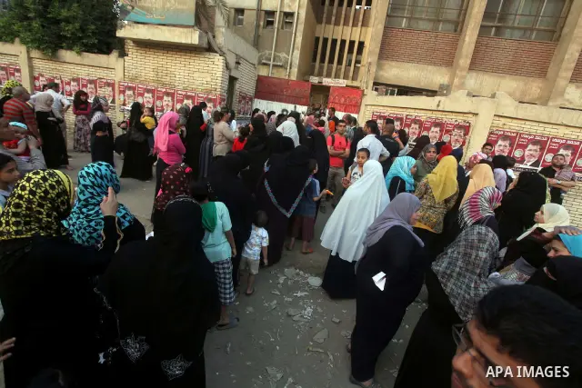 Voters wait outside a polling station in Cairo during presidential elections May 24, 2012. Egypt resumes its first free presidential election on Thursday after voting passed off mostly calmly on the first day apart from...