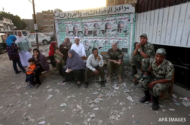 Voters wait outside a polling station in Cairo during presidential elections May 24, 2012. Egypt resumes its first free presidential election on Thursday after voting passed off mostly calmly on the first day apart from...
