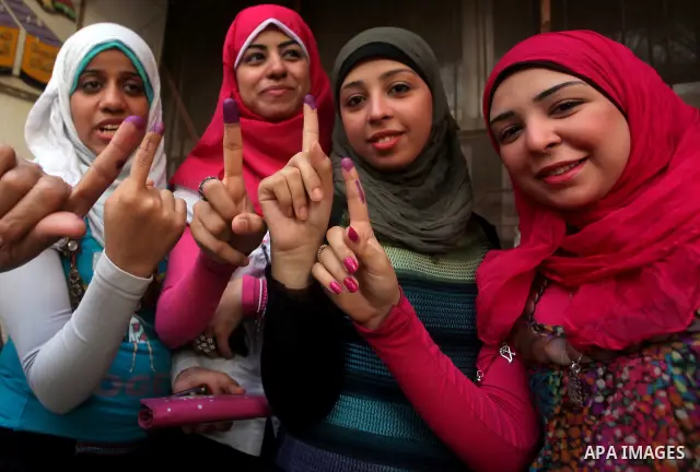 Egyptian women show thier ink-marked finger after casting thier ballot during the first round of Egypt's presidential elections, at a polling station in Cairo, Egypt, 24 May 2012. for the first Presidential election sinc...